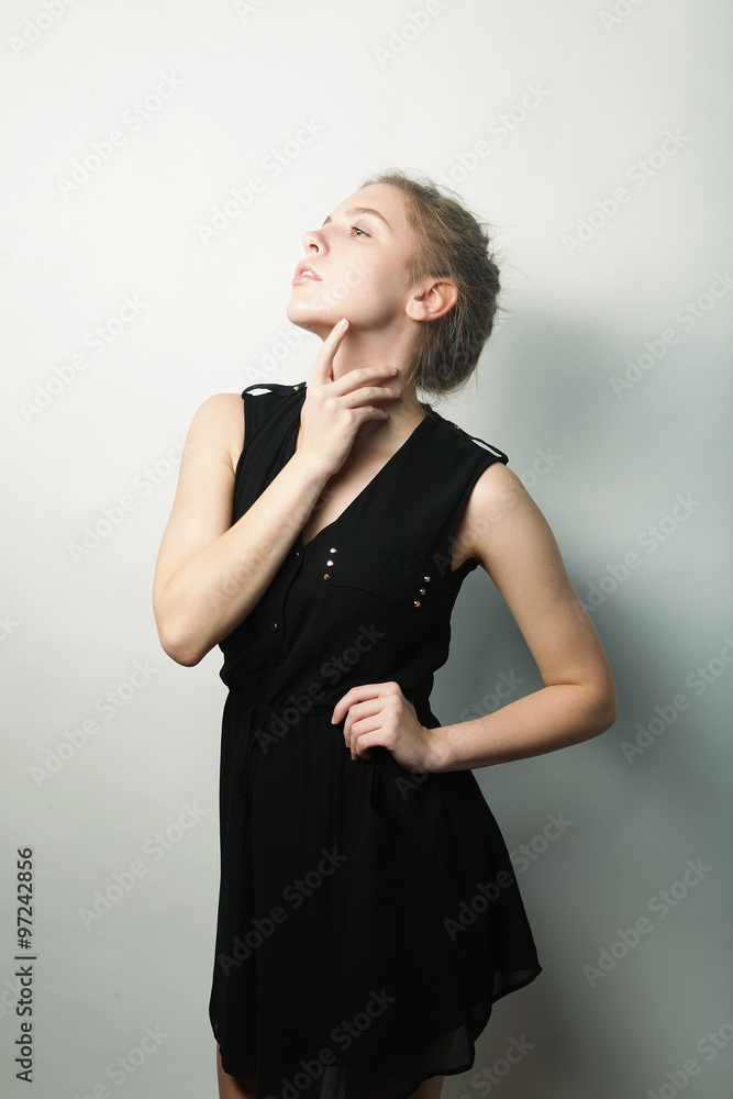 young fashion blond woman in black dress young fashion blond woman in black dress
