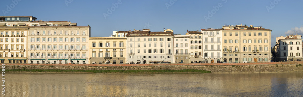 Evening light on riverbank of the Arno in downtown Florence