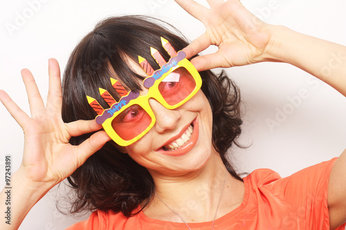happy woman with big orange sunglasses