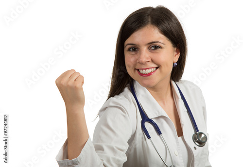 Portrait of young beautiful female doctor celebrating success