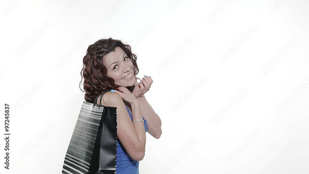 4k - Young attractive woman throws a shopping bag over her shoulder 4k - Young attractive woman throws a shopping bag over her shoulder