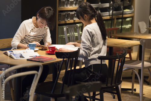 Women are spent with friends in a cafe