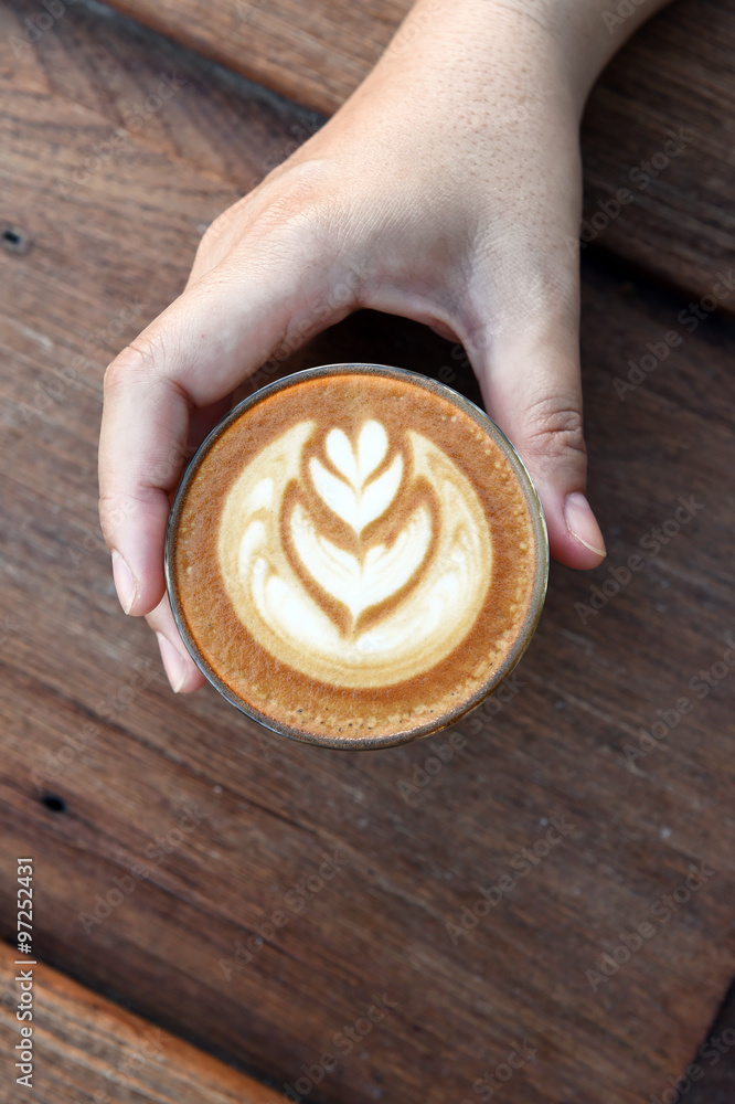 a cup of latte art coffee. a cup of latte art coffee.