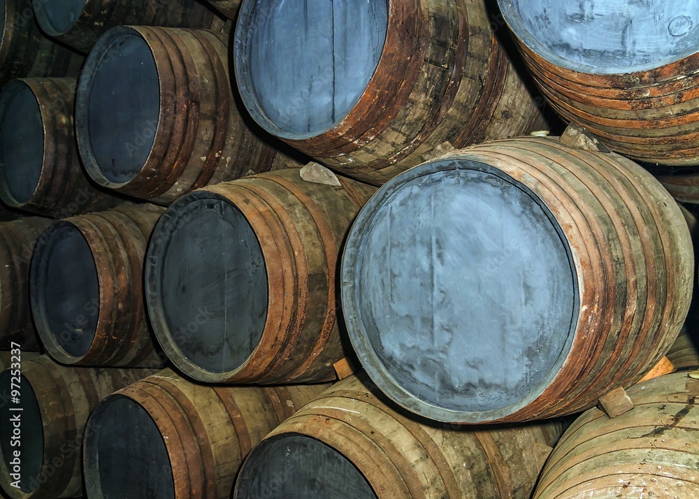 old oak barrels in the wine cellar old oak barrels in the wine cellar