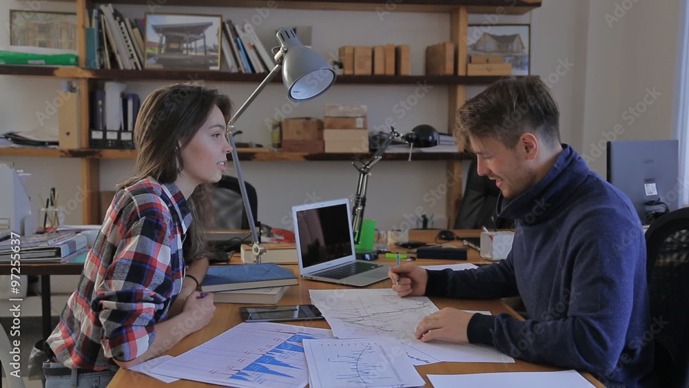 girl came to his financial adviser. charts, analysis, annual reports, consultation in the office girl came to his financial adviser. charts, analysis, annual reports, consultation in the office