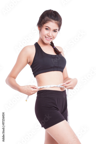 Fitness young woman taking measurements of her body. healthy concept © japhoto