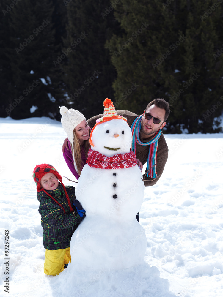 happy family making snowman