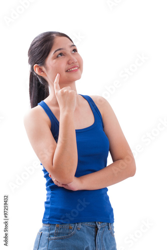 Beautiful young woman thinking and looking up on white background © japhoto