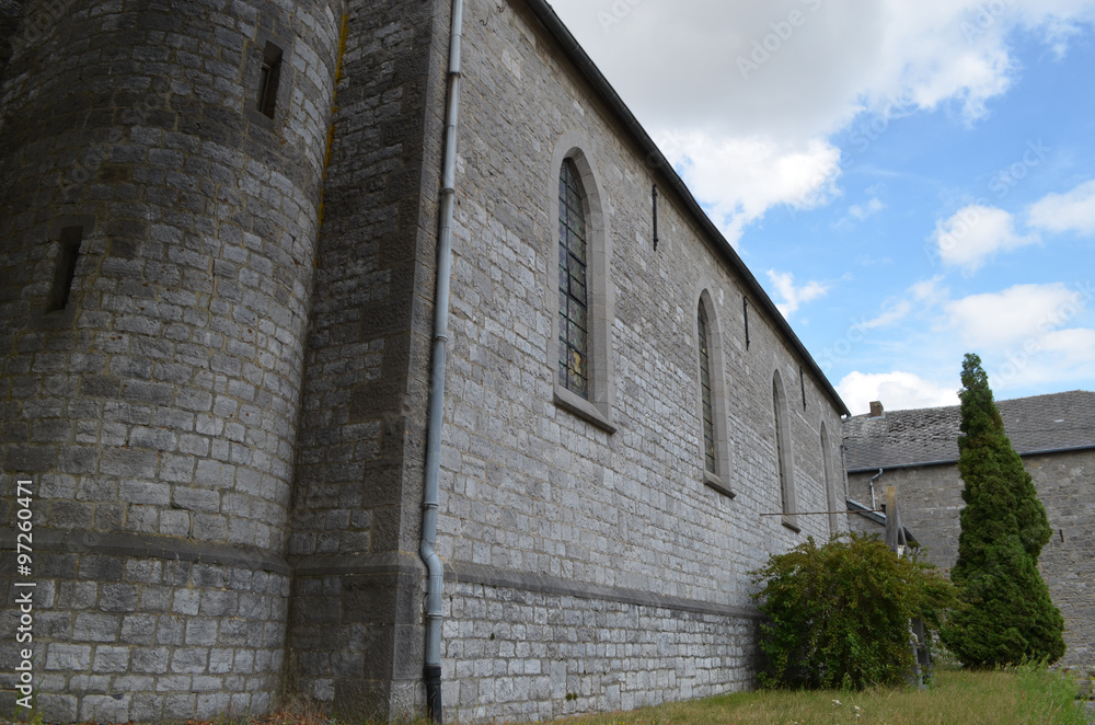 Fototapeta premium Wall of grey brick church, Wallonia