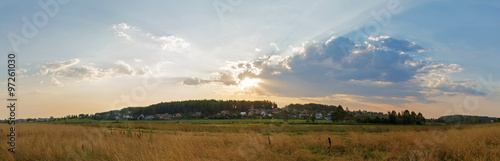 Sunset in the countryside. Panoramic rural landscape.