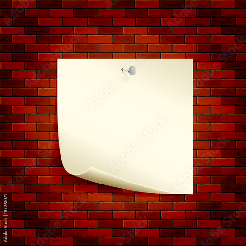 Paper on a brick wall