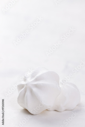 Closeup of meringue cookies on a white background  selective focus.