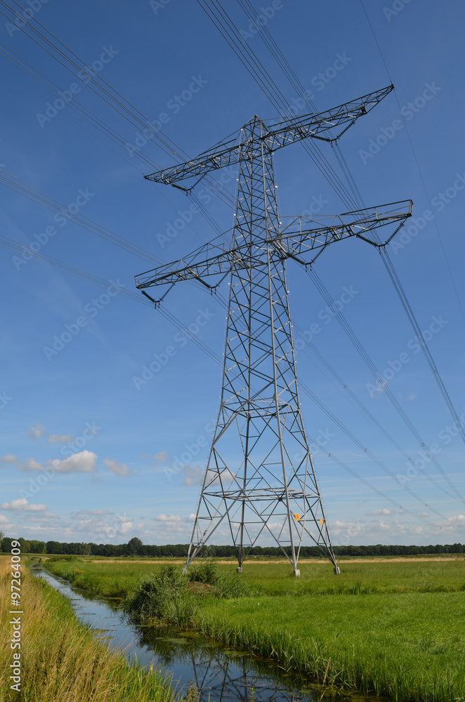 Electricity post in a meadow with a ditch, Dutch polders Electricity post in a meadow with a ditch, Dutch polders