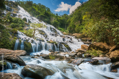 Mae Ya Waterfall is one of the most beautiful cascades in Doi Inthanon, Chiang Mai. Water flows from a 280-metre steep cliff onto different rock formations in a lower basin, creating a beautiful scene