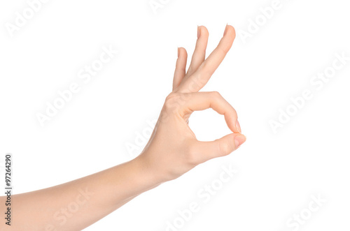 Beauty and Health theme: beautiful elegant female hand show gesture on an isolated white background in studio