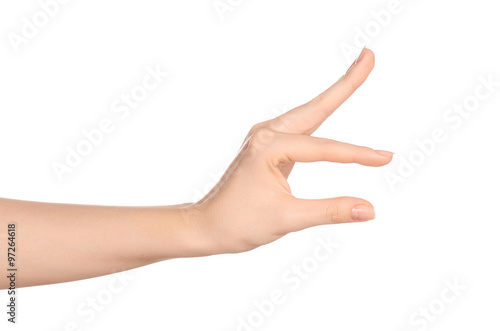 Beauty and Health theme: beautiful elegant female hand show gesture on an isolated white background in studio