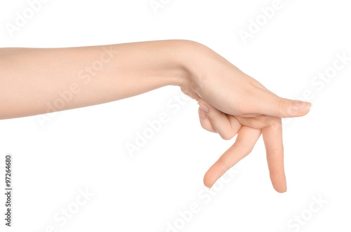 Beauty and Health theme: beautiful elegant female hand show gesture on an isolated white background in studio