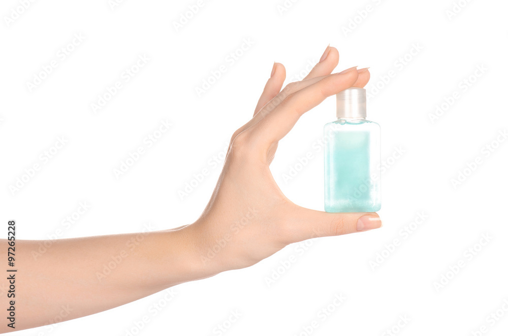 Beauty and health topic: a woman's hand holding a small green bottle of  shampoo in the studio isolated on a white background Photos | Adobe Stock
