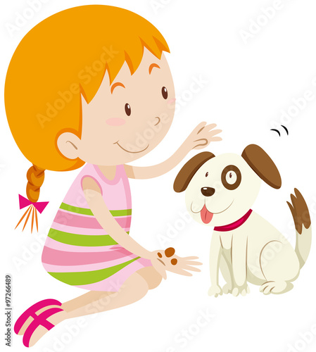 Cute girl feeding her pet dog