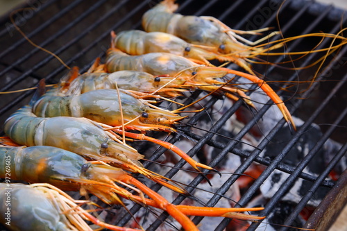 Fried big shrimps seafood on the flaming grill