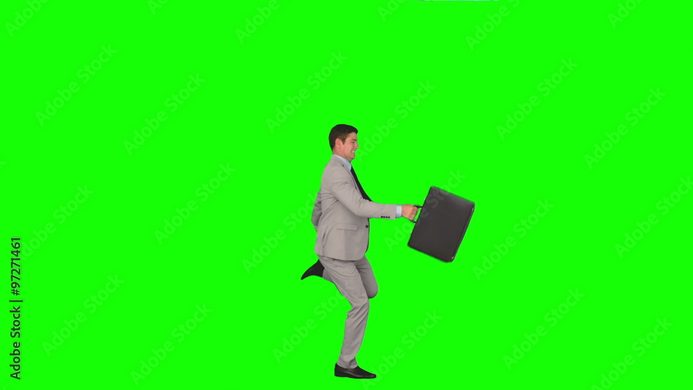 Businessman running and jumping in slow motion Businessman running and jumping in slow motion