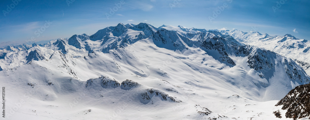 Fototapeta premium sporty woman looking to snow mountains