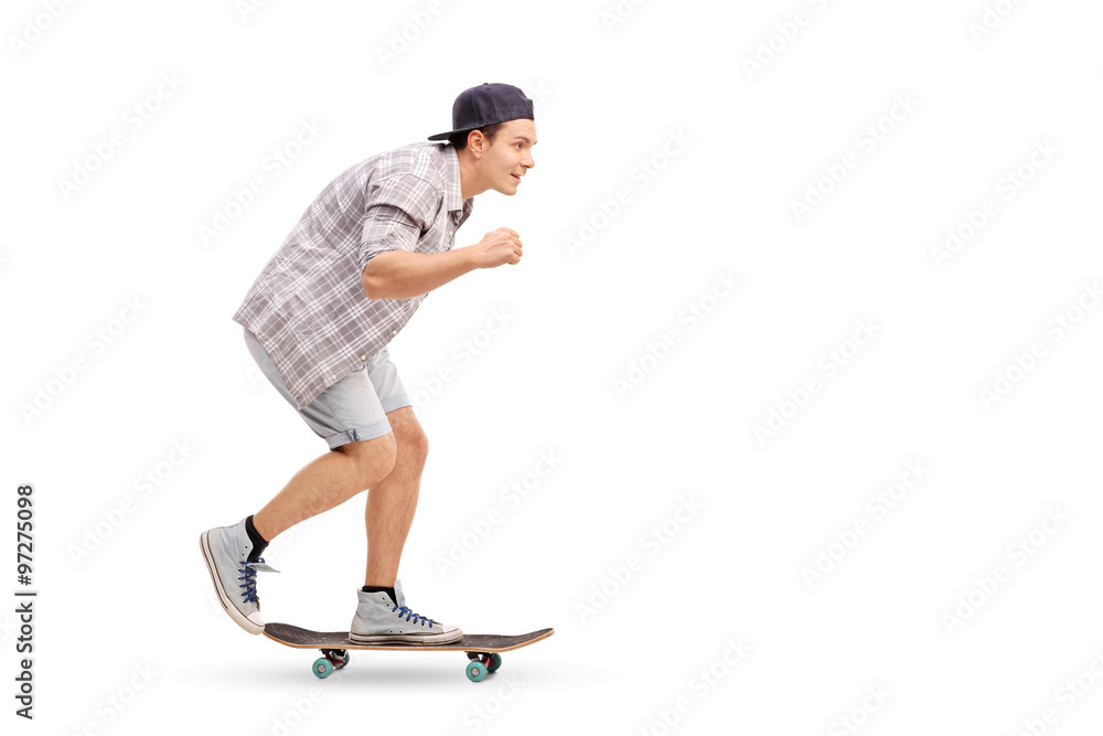 Naklejka premium Young man riding a skateboard