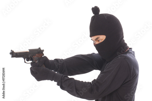 Burglar holding hand gun 