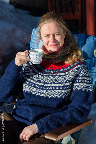 Close up of young pretty Norwegian woman enjoying some winter su