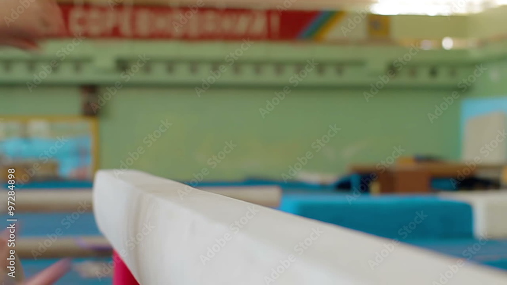 Gymnast practicing on balance beam Slow motion Gymnast practicing on balance beam Slow motion