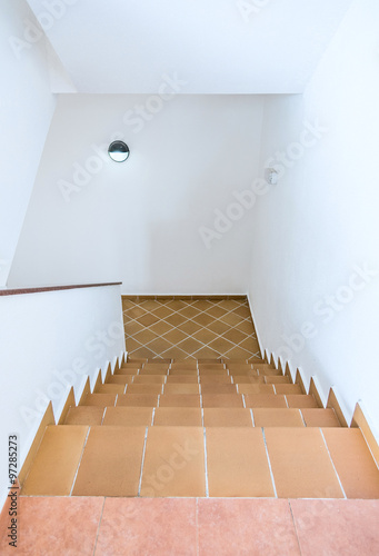 tile staircase with a handrail