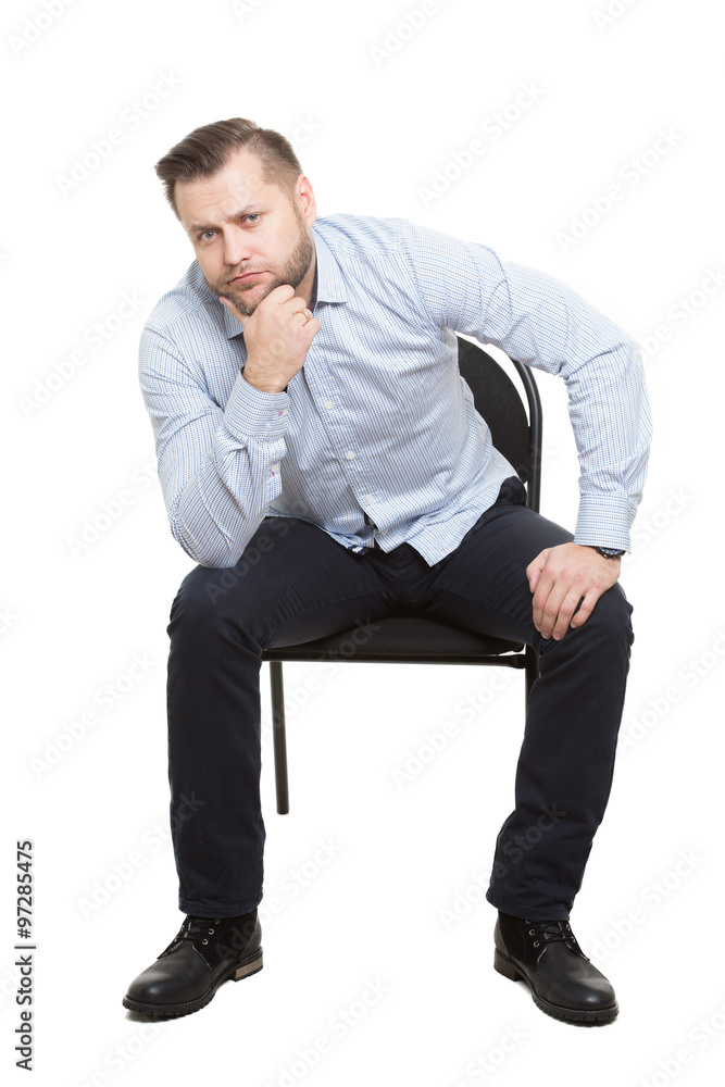 Female professional with laptop sitting on chair at office stock photo