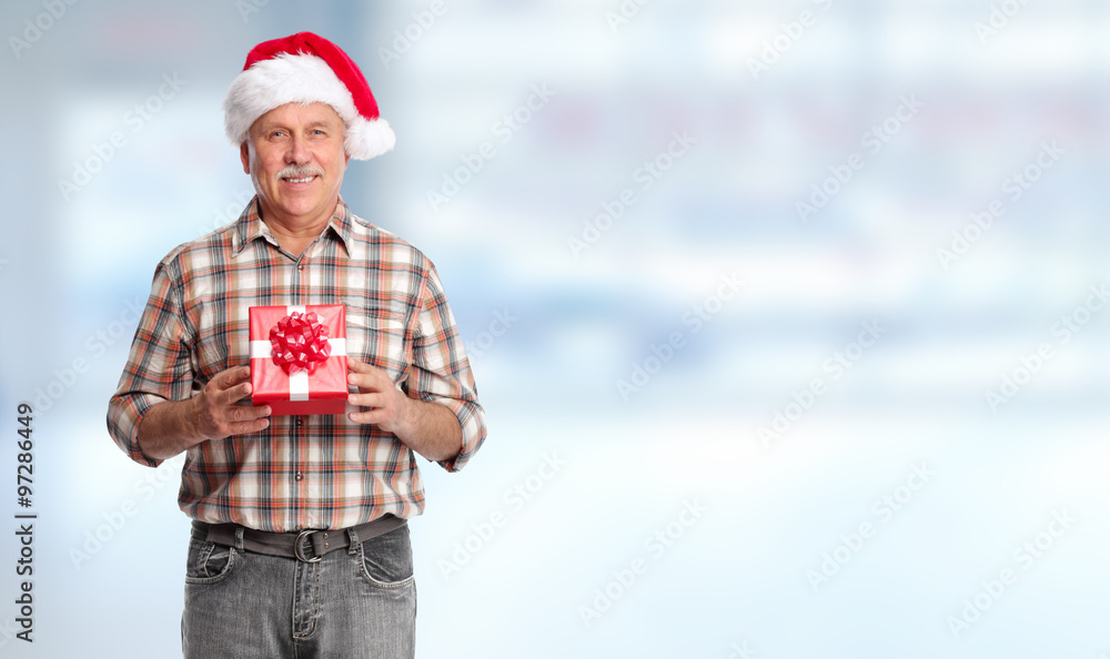 Obraz premium Happy Christmas man with xmas gift.