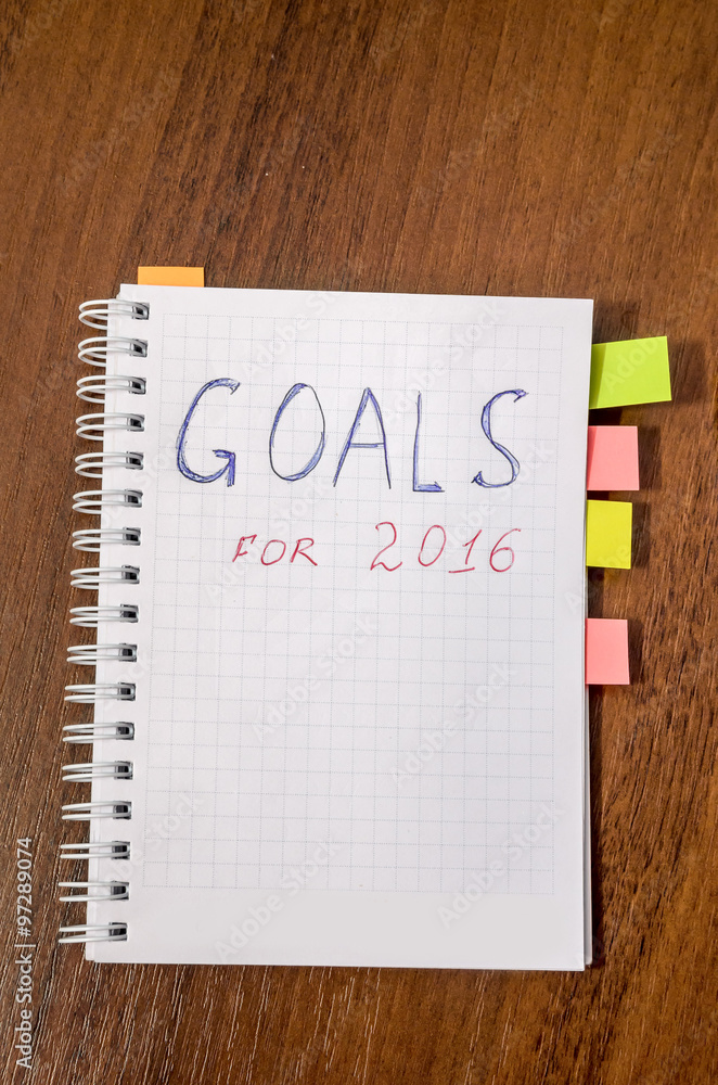 goals of year 2016 write on notebook on wooden background goals of year 2016 write on notebook on wooden background