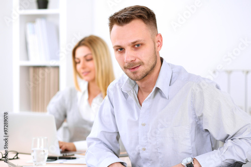 Two successful business partners working at meeting in office