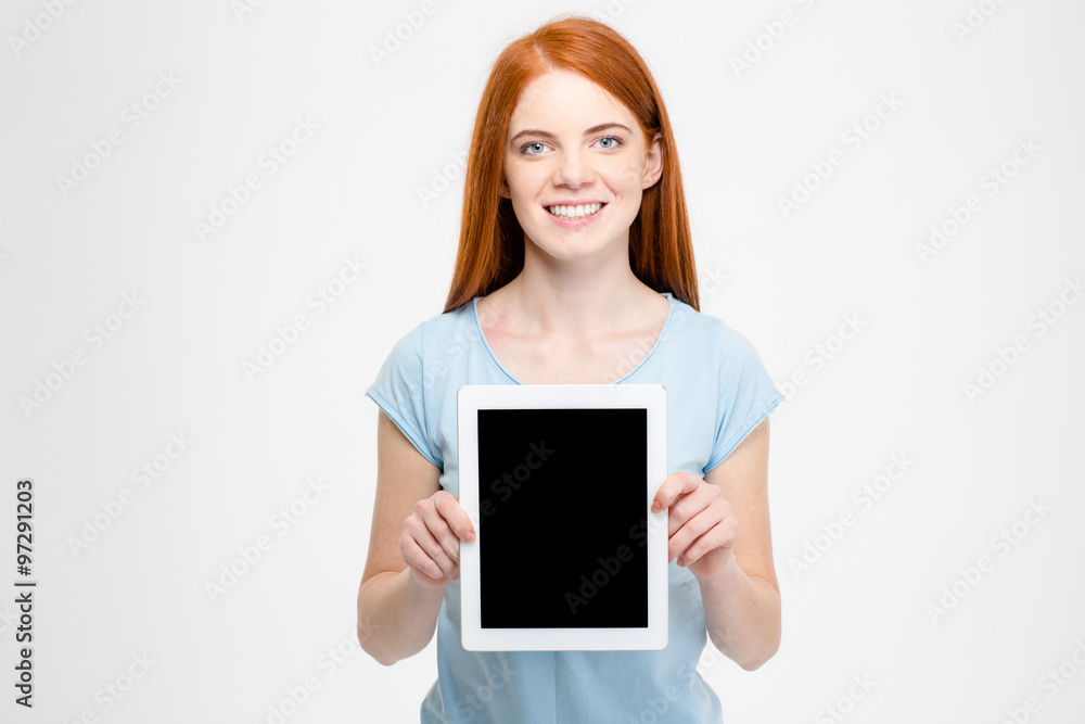 Redhead woman showing blank tablet computer screen Redhead woman showing blank tablet computer screen