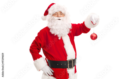 Santa Claus holding a red Christmas ball