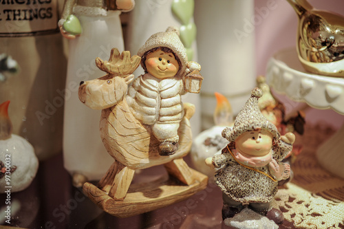 Christmas items on wooden shelf:  statue, statues, figures photo