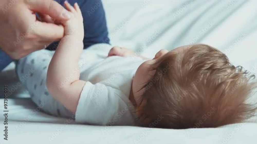 Father kissing newborn baby