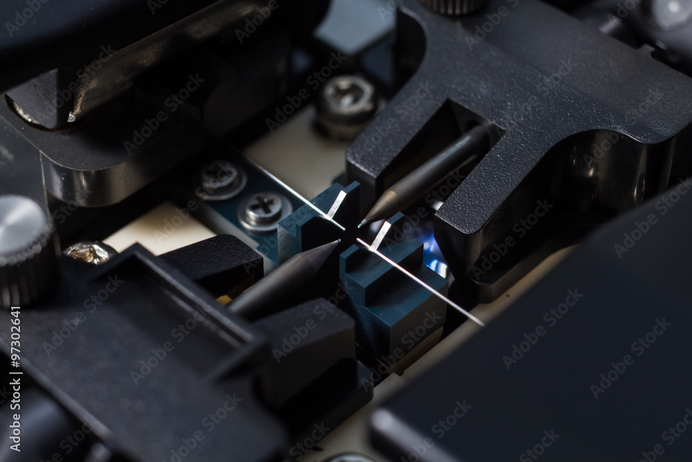 Naklejka premium Working with fiber optic fusion splicer before connecting. Selec