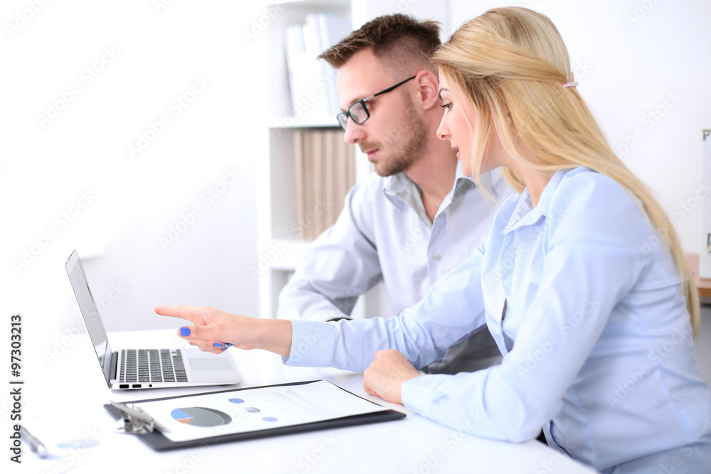 Two successful business partners working at meeting in office Two successful business partners working at meeting in office