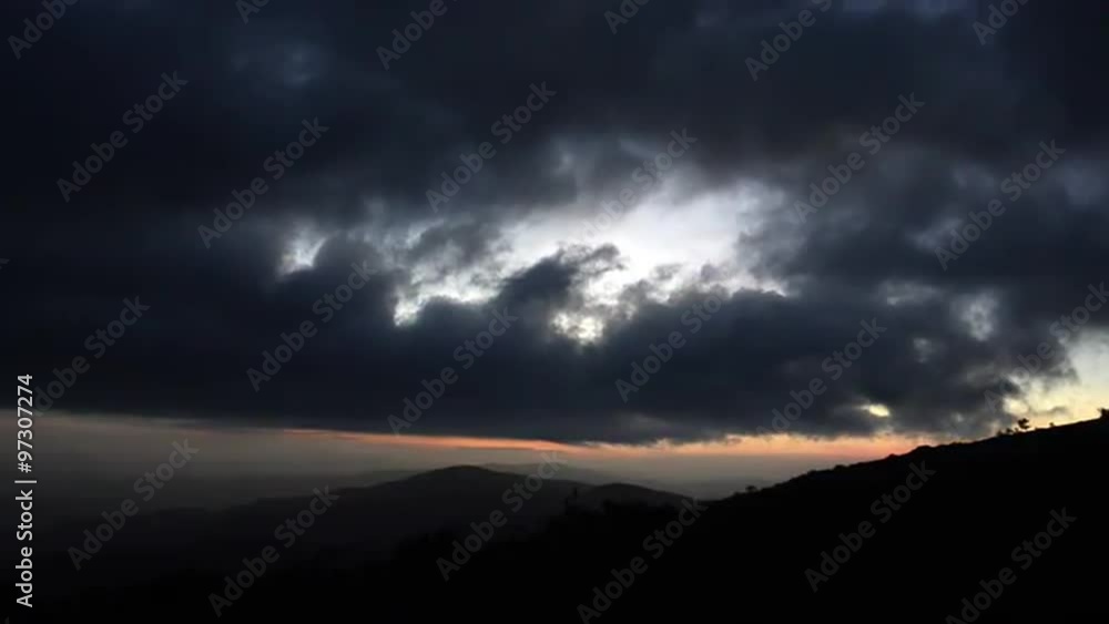 As night falls over the mountains, clouds move across a faintly pink sky in the Roan Mountain Highlands As night falls over the mountains, clouds move across a faintly pink sky in the Roan Mountain Highlands