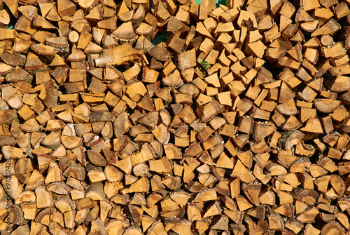 Stack of chopped firewood prepared for winter