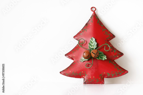Metal christmas tree decoration on white isolated background