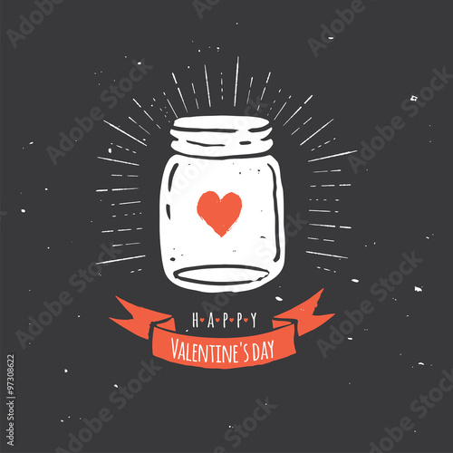 mason jar with heart, love quote on the black chalkboard