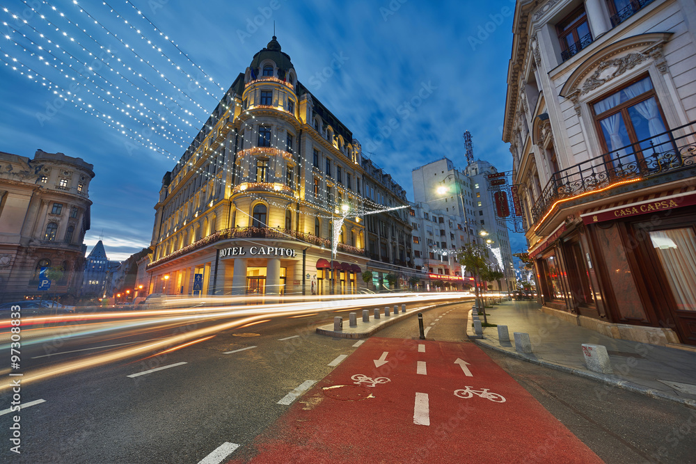 Naklejka premium BUCHAREST, DEC 2015: Night Lights on Calea Victoriei Street, near Hotel Capitol.