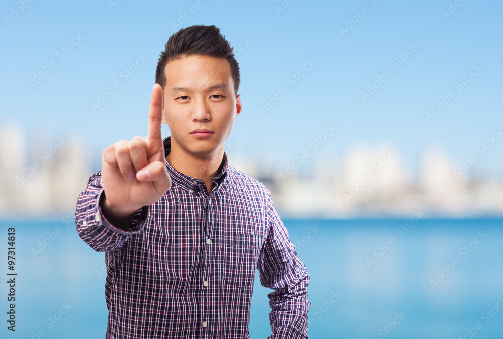 Fototapeta premium portrait of an asian man doing the one gesture