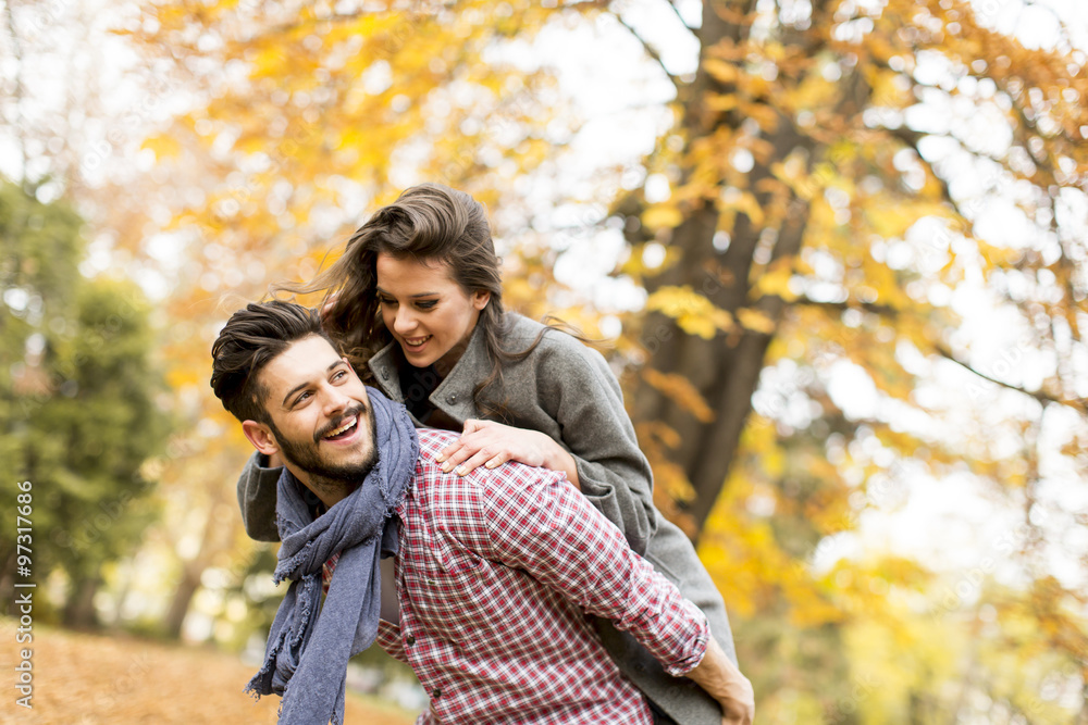 Fototapeta premium Young couple in the autumn forest