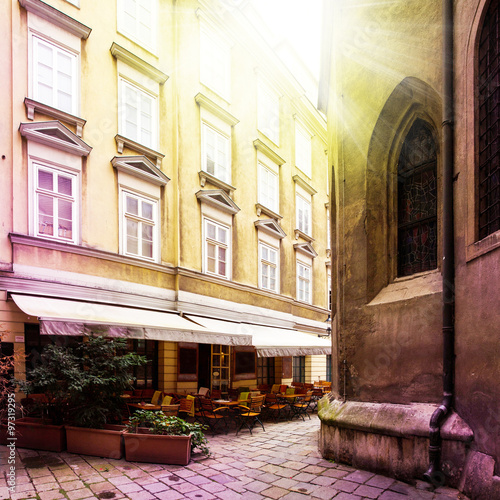 Photography Old small street with Cafe terrace in small vienna