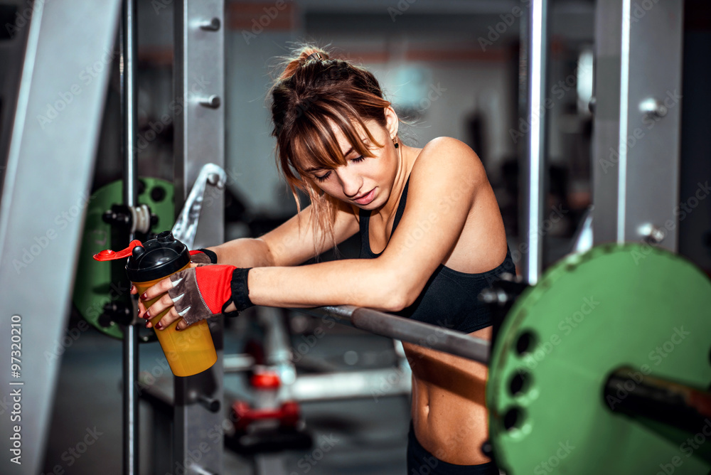Fototapeta premium Young pretty girl work out in the gym